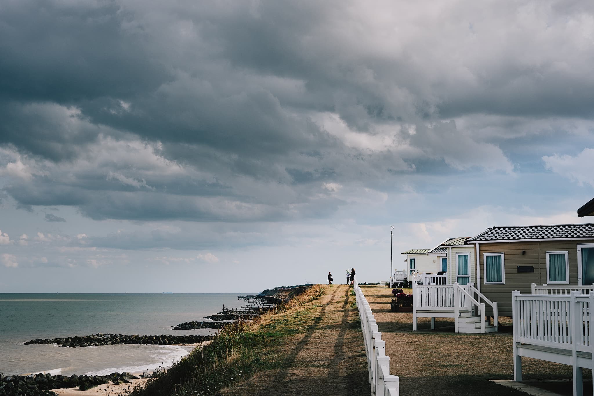 looking back towards the peak of a cliff alongside Hopton holiday village