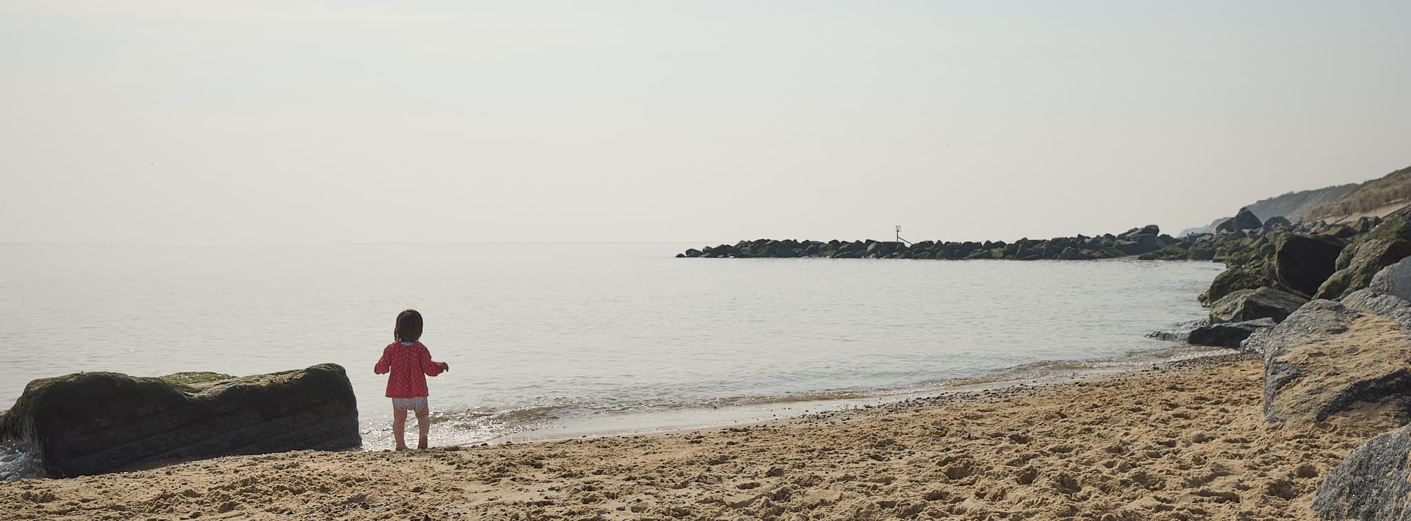 Emily standing on the shore