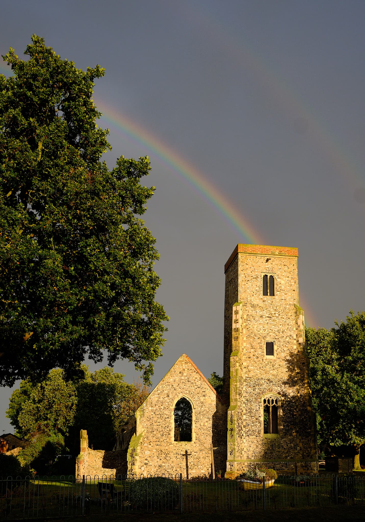 double rainbow over ruined church