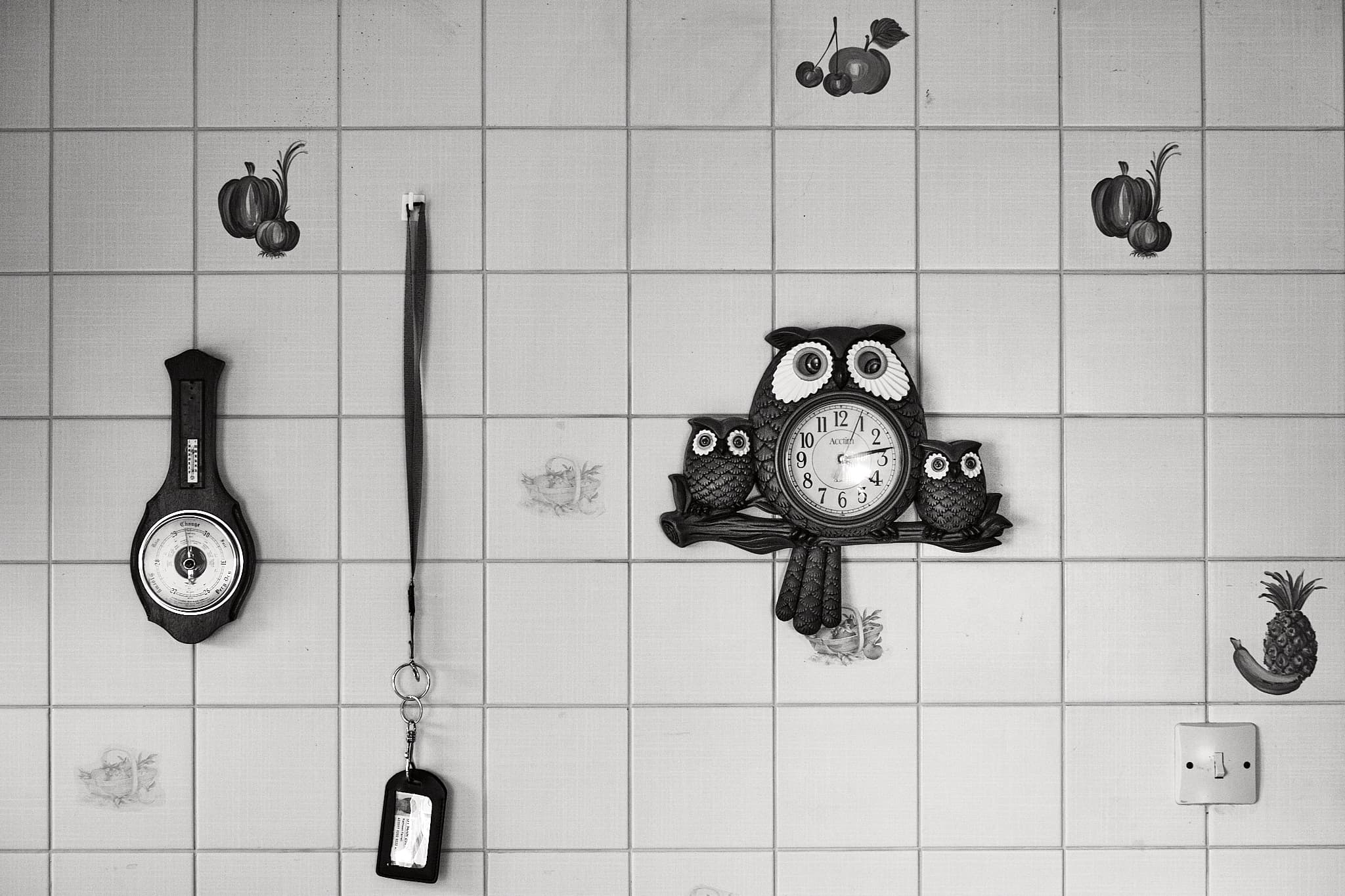 owl clock and other things on the wall of my parents’ kitchen