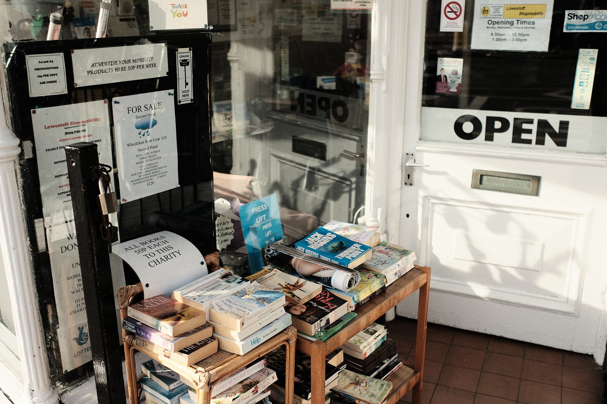 books for sale in front of a charity shop