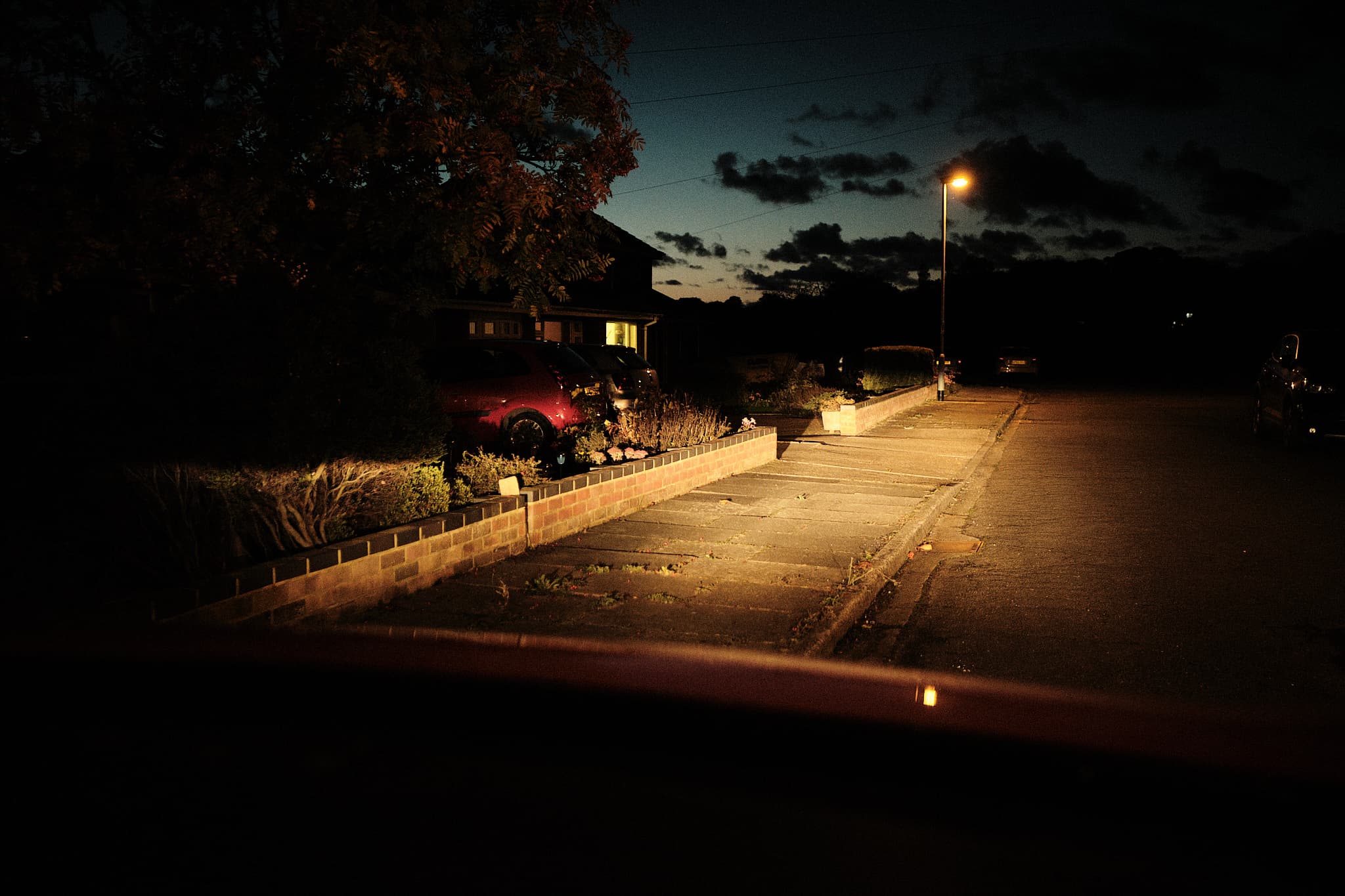 night time view from out of my car as I’m parked by the side of the road