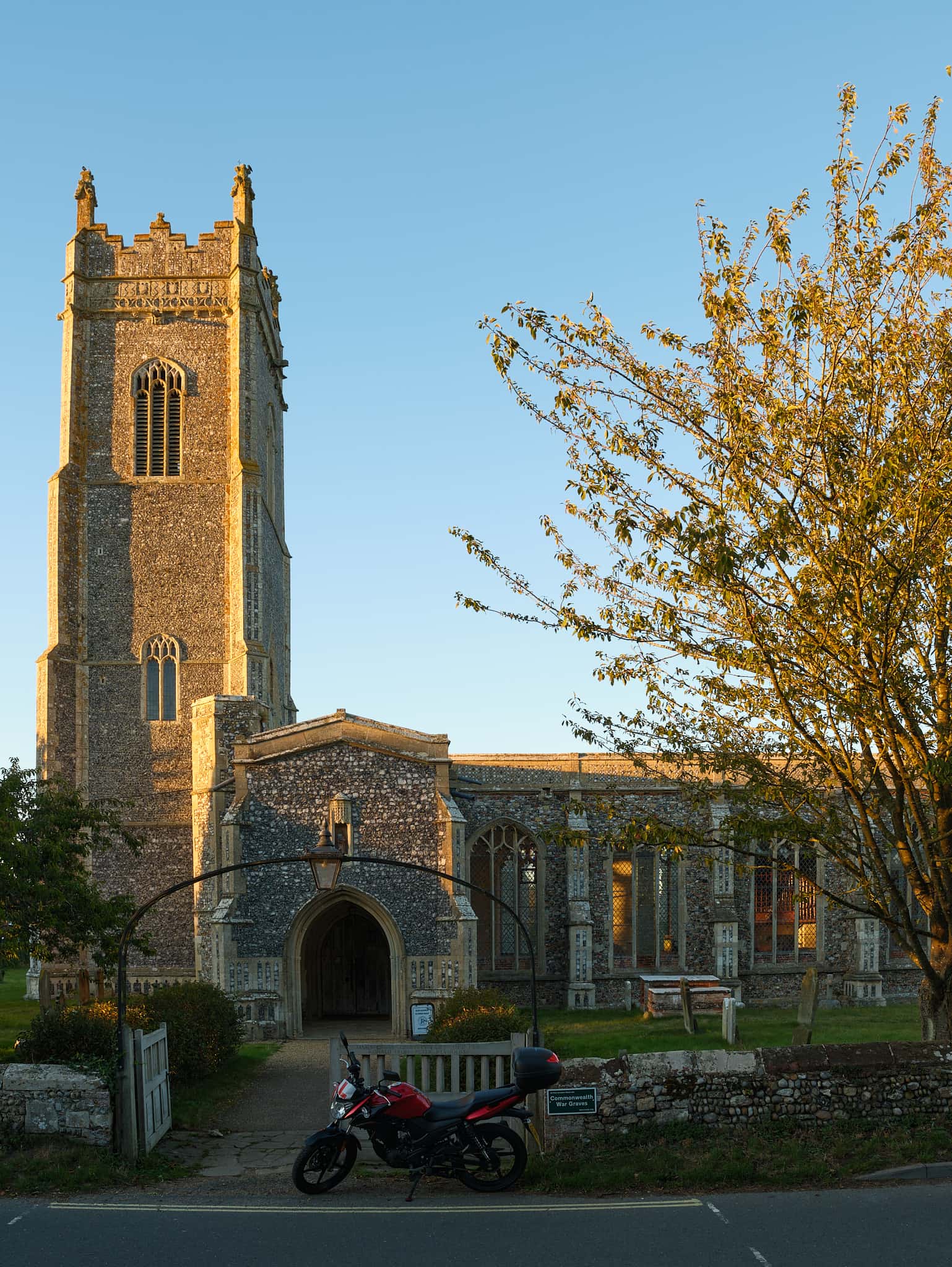 the bike parked outside the church in Walberswick